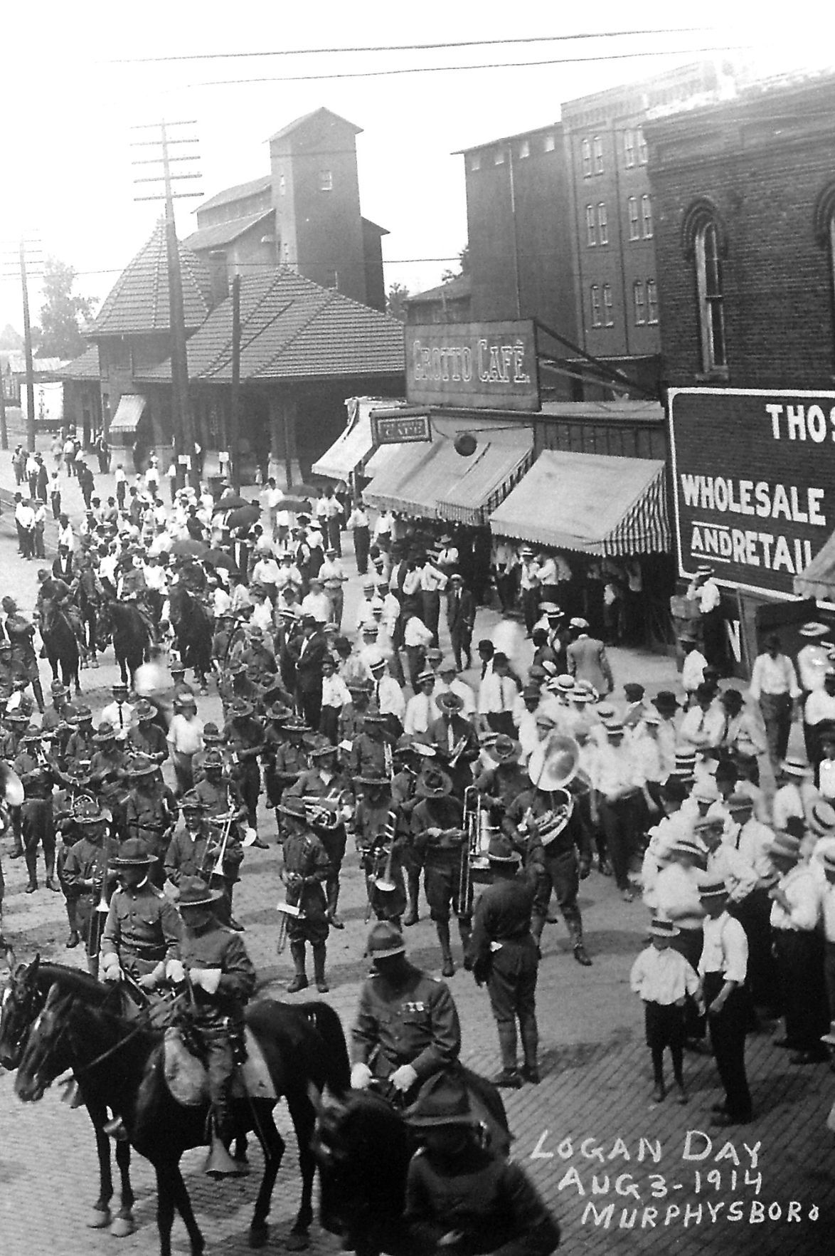 Train station in background of 1914 'Logan Day' pictures